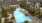 Aerial view of Edera Palm Springs' shimmering resort-style pool