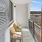 Furnished private balcony inside a model apartment at Edera Palm Springs
