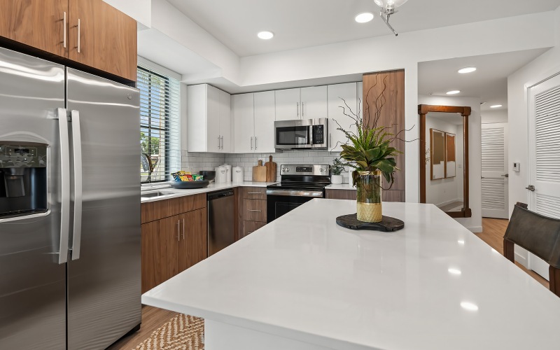 Modern apartment kitchens with GE stainless steel appliances at Edera Palm Springs