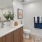 Ample countertop space and large mirror inside apartment bathrooms at Edera Palm Springs