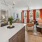 Ample natural lighting and large kitchen island inside an apartment home at Edera Palm Springs