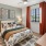 Furnished apartment bedroom with a large window bringing in ample natural light at Edera Palm Springs
