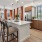 Modern apartment kitchens with kitchen islands and stainless steel appliances at Edera Palm Springs