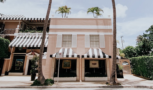 Lifestyle photo of a tropical pink beach house